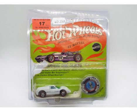 Hot Wheels - Redline - An original unopened carded Ford J-Car model in Enamel White. This Hong Kong made model appears Near M