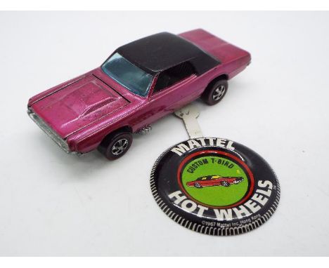 Hot Wheels - Redline - A Custom T-Bird in Creamy Pink. This Hong Kong made model appears in Very Good condition with only lig