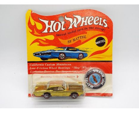 Hot Wheels - Redline - An unopened carded original Custom Continental in Gold. The car appears still to be Mint on a Very Goo