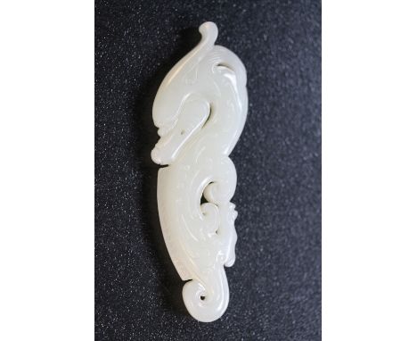 WHITE JADE - a Chinese white jade dragon pendant, measuring approximately 11cm and weighing 54.3g.