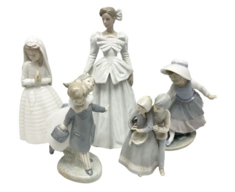 Three Nao figures comprising The Next Dance 1201 and Girls First Communion 0236, and young girl wearing a hat, together with 