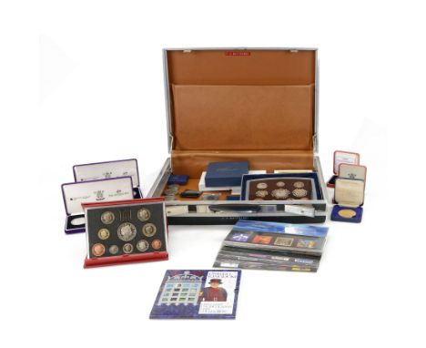 Great British coins and stamps, including two 2002 'The Accession Set' silver proof three coin sets, 1998 '25th Anniversary E