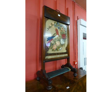 An early Victorian rosewood and embroidered fire screen, 100cms h x 51cms w 