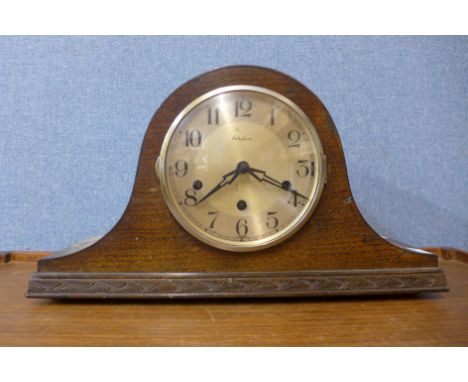 An oak mantel clock, 23cms h 