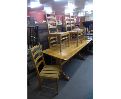 An Ercol pine refectory table and six chairs 