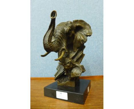 A French style bronze elephant bust, on black marble socle, 28cms h 