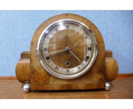 A walnut and chrome mantel clock,  22cms h 