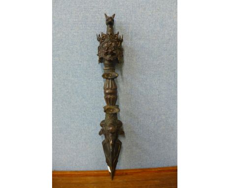 An oriental bronze ritual staff, 63cms l 