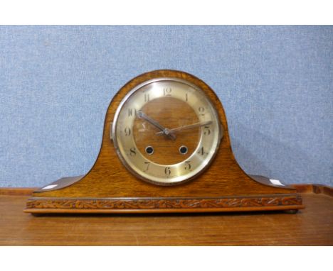 An oak mantel clock, 22cms h 