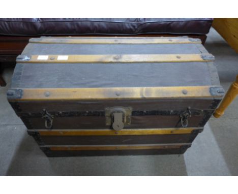An early 20th Century dome topped steamer trunk 