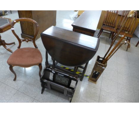 A Victorian mahogany balloon back chair, an oak gateleg table, a magazine rack and stick stand and walking sticks 