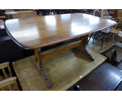 An Ercol Golden Dawn elm refectory table 