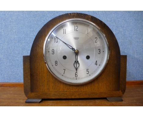 A Smiths Enfield oak mantel clock, 23cms h 