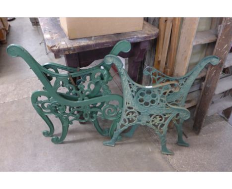 Two pairs of cast iron garden bench ends 