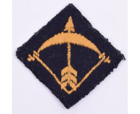 64th (London) Field Regiment Royal Artillery Cloth Formation Sign, yellow embroidered bow and arrow on black diamond cloth ba