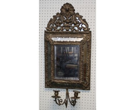 A 19th century pressed brass cushion frame wall mirror with bevelled rectangular primary plate. 69 x 33 cms