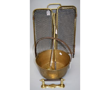 A Victorian brass preserve pan with steel handle, a brass and wirework spark guard, a skimming spoon with pierced brass bowl,