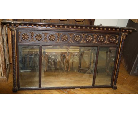 A Regency gilt, three section over-mantle mirror with composition appliques and flanked by classical columns.142cm wide