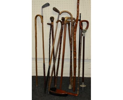 An early 20th century "Black-Forrest" carved "Alpen-Stock" walking stick with long dog's head handle. Together with other vin