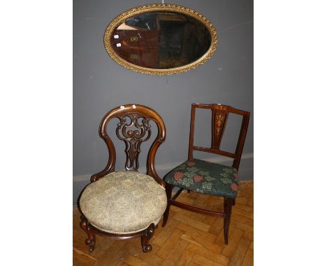 A Victorian carved and pierced, arch back nursing chair with stuff over seat . Raised on squatt cabriole supports. Together w