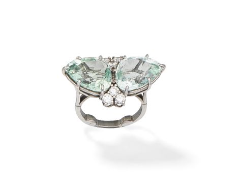 AQUAMARINE AND DIAMOND DRESS RINGSet with two pear-shaped aquamarines, between trios of brilliant-cut diamonds,  ring size ap