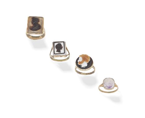 FOUR CAMEO RINGS1st: The amethyst plaque carved to depict a monkeys head, 2nd: The banded agate plaque carved to depict a mou