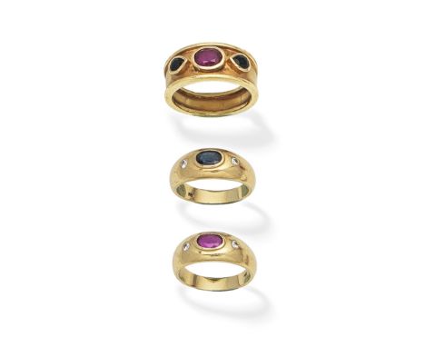 THREE GEM-SET RINGS1st: The oval-cut ruby between pear-shaped sapphires, 2nd: Two rings, each set with an oval-cut ruby or si