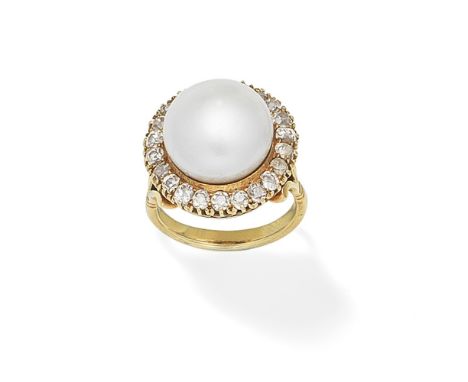 CULTURED PEARL AND DIAMOND RINGThe 13.2mm cultured pearl within a cushion-shaped diamond surround, between fleur-de-lys shoul