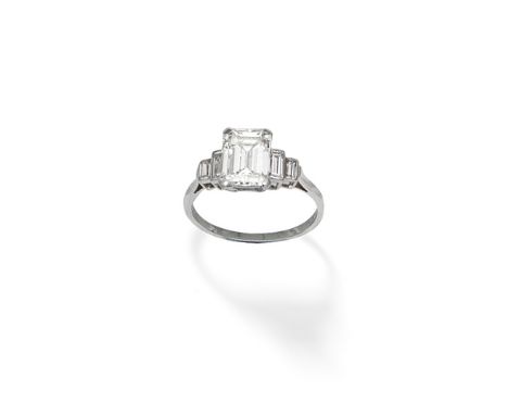 DIAMOND RINGThe step-cut diamond weighing 2.12 carats, set between tiered baguette-cut diamond shoulders,  ring size approx. 