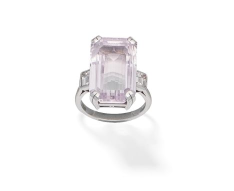 KUNZITE AND DIAMOND RING, 2004The rectangular step-cut kunzite, between step-cut diamond shoulders, mounted in 18 carat white