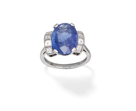 SAPPHIRE AND DIAMOND RINGThe oval-cut sapphire, between step-cut diamond shoulders, diamonds approx. 0.80ct total, ring size 