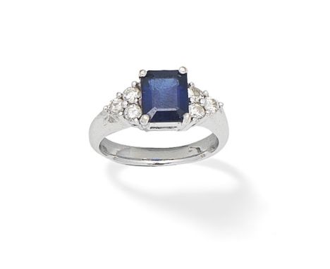 SAPPHIRE AND DIAMOND RINGThe step-cut sapphire, between trios of brilliant-cut diamonds,  ring size approx. MFor further info