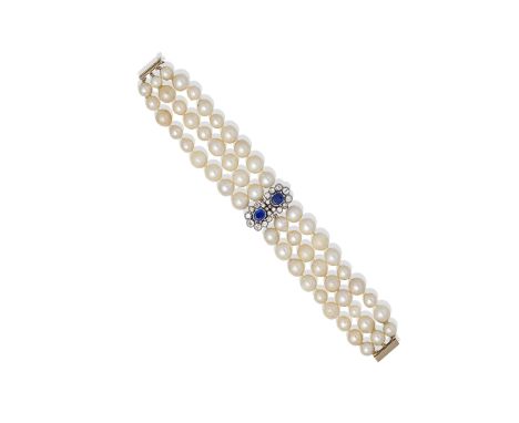 CULTURED PEARL, SAPPHIRE AND DIAMOND BRACELETThe three rows of 6.5-8.8mm cultured pearls, centrally set with two oval-cut sap