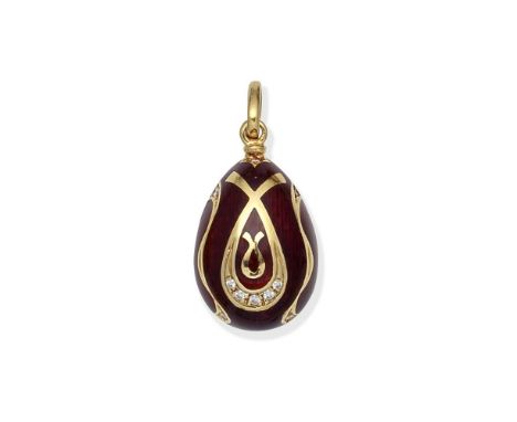 FABERGÉ: ENAMEL AND DIAMOND EGG PENDANTDecorated with red guilloche enamel, with scrolling detail to the front set with brill