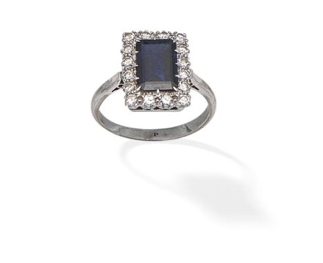 SAPPHIRE AND DIAMOND CLUSTER RINGThe step-cut sapphire within a brilliant-cut diamond surround, ring size approx. OFor furthe