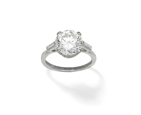 DIAMOND SINGLE-STONE RINGThe brilliant-cut diamond, weighing 3.55 carats, between baguette-cut diamond shoulders, ring size a