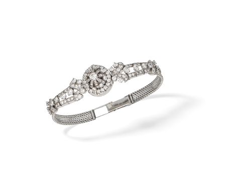 DIAMOND WATCH/BRACELETThe circular dial with baton and Arabic hourmarkers, concealed beneath a brilliant-cut diamond case, th