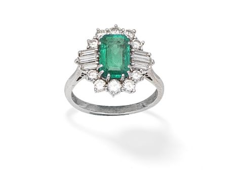 EMERALD AND DIAMOND CLUSTER RINGThe step-cut emerald within a brilliant and baguette-cut diamond surround, diamonds approx. 0