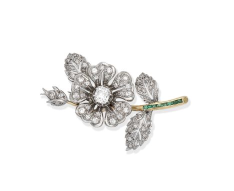 DIAMOND AND EMERALD-SET FLORAL BROOCHThe flowerhead and leaves set with brilliant and old brilliant-cut diamonds, the stem se