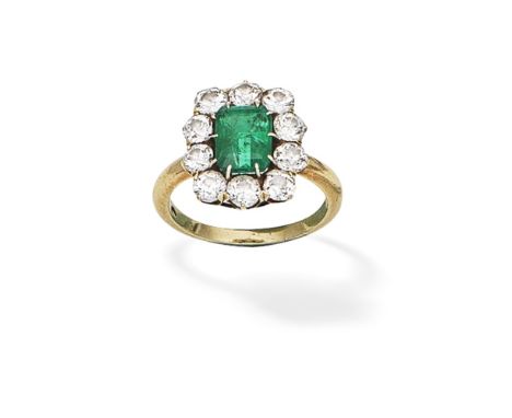 EMERALD AND DIAMOND CLUSTER RING, CIRCA 1880The step-cut emerald within a surround of old brilliant-cut diamonds,  diamonds a