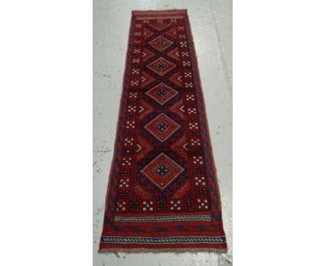 A red & blue patterned Meshwani runner, 254 x 63cms
