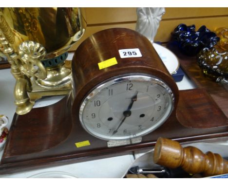 An early twentieth century mahogany Napoleon's hat mantel clock by Enfield with hallmarked silver inscription plaque