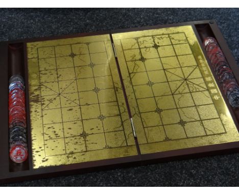 A boxed Mahjong set in carry bag