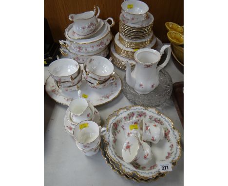 A large parcel of Paragon 'Victoriana Rose' patterned tea & dinnerware together with two Royal Worcester 'Evesham Gold' flan 