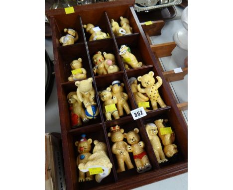 A collection of ceramic teddy bears & wall hanging display stands