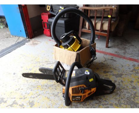 A McCulloch petrol chainsaw & an electric car buffer