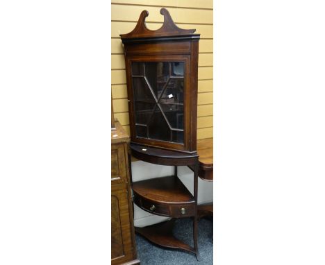 A mahogany & inlaid standing corner cabinet on a raised open shelf base