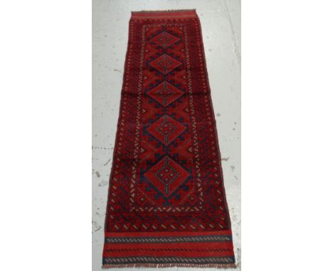 A red & blue patterned Meshwani runner, 243 x 64cms
