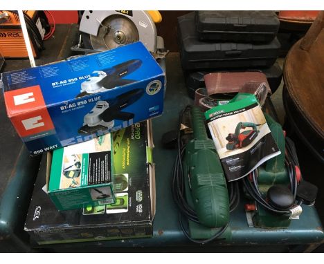 A Parkside electric planer; together with a Parkside belt sander with multiple packs of spare belts; Parkside soldering iron;