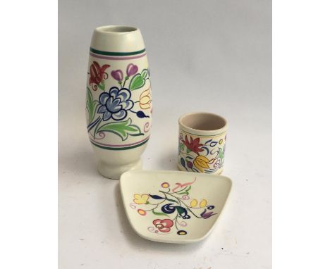 Three Poole pottery items - a vase, a rectangular dish, and a pot 